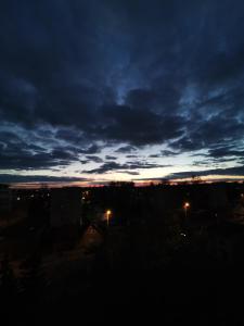 a view of a cloudy sky at night at R&J Apartment I in Panevėžys