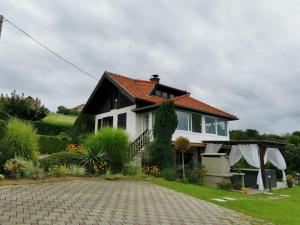 a white house with a red roof and a driveway at Small Hill Heaven in Varaždin Breg