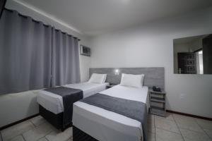 Posteľ alebo postele v izbe v ubytovaní Lumar Hotel