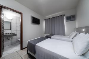 Posteľ alebo postele v izbe v ubytovaní Lumar Hotel