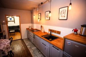 a kitchen with a sink and a counter top at 1950wisla Dom w górach in Wisła