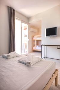 Postel nebo postele na pokoji v ubytování Belsun Hotel