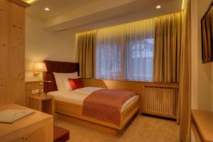 Postel nebo postele na pokoji v ubytování Hotel Palin