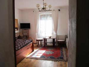 a living room with a couch and a table at Chata za Górami in Zagórze Śląskie