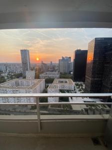 a view of a city skyline from a balcony at Appartement La Défense The View in Puteaux