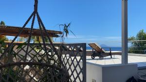 a patio with a barbecue grill on a balcony at B&B Le Sette Vele Da Riccardo in Santa Marina Salina