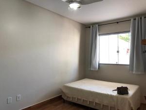 Postel nebo postele na pokoji v ubytování Casa com Piscina e Churrasqueira e excelente Localização em Piuma