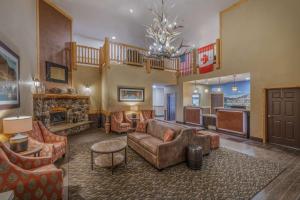a large living room with a couch and chairs at Best Western Plus Riverfront Hotel and Suites in Great Falls