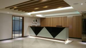 a lobby with a reception desk in a building at 萬酈精品旅館 in Kaohsiung