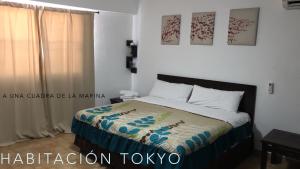 Postel nebo postele na pokoji v ubytování Cabo Tortuga Hotel Boutique