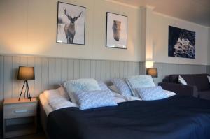 Postel nebo postele na pokoji v ubytování Revontuli Resort Rooms