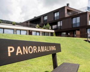 a sign that reads panomedalling in front of a building at Aparthotel Panorama Living Dolomites in Maranza