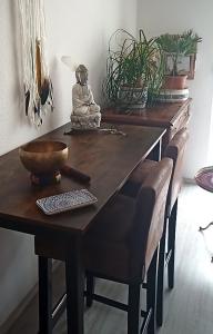 a wooden table with a bowl on top of it at Appartement Sternblick in Bad Reichenhall