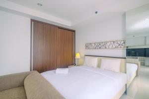 Postel nebo postele na pokoji v ubytování Stunning Studio Azalea Suites Apartment By Travelio + 11 fotografií