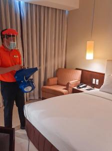 Rúm í herbergi á The B Hotel Alabang