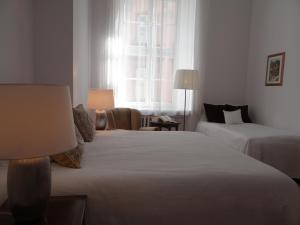 Posteľ alebo postele v izbe v ubytovaní Boutique Aparthotel