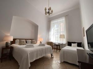 Posteľ alebo postele v izbe v ubytovaní Boutique Aparthotel