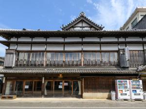 an old building with an asian style building at Tabist Asanokan Annex Iroha Ise in Ise