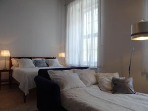 Posteľ alebo postele v izbe v ubytovaní Boutique Aparthotel