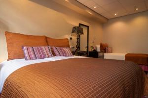 Postel nebo postele na pokoji v ubytování Hotel Sebastians