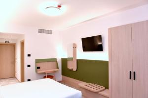 Postel nebo postele na pokoji v ubytování Hotel Casa Del Pellegrino