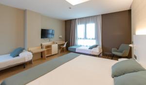 Posteľ alebo postele v izbe v ubytovaní Hotel Olympia Valencia