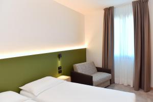 Postel nebo postele na pokoji v ubytování Hotel Casa Del Pellegrino