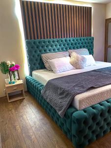 Ένα ή περισσότερα κρεβάτια σε δωμάτιο στο Loft Apartman Menhetn