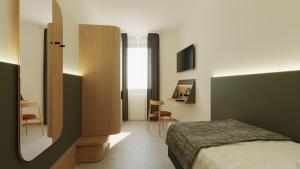 Postel nebo postele na pokoji v ubytování Hotel Casa Del Pellegrino