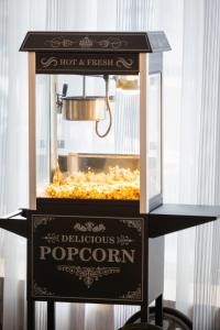 a food cart with a pot of popcorn on it at ibis Styles Calais Centre in Calais
