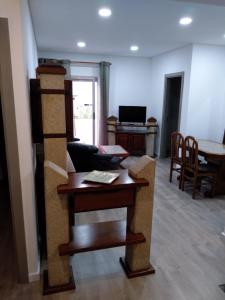 a living room with a couch and a table at Apartamento Balsa 2 in Viseu