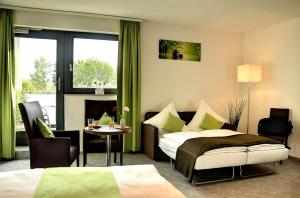 Postel nebo postele na pokoji v ubytování Motel am Fürfelder Schloss