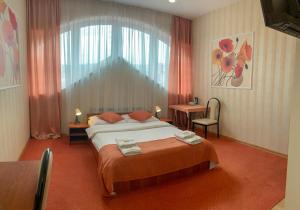 Posteľ alebo postele v izbe v ubytovaní Hotel Ostoja