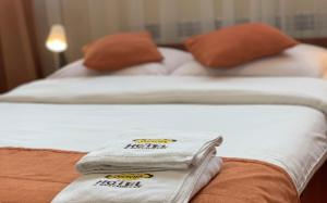 Posteľ alebo postele v izbe v ubytovaní Hotel Ostoja