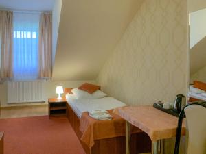 Posteľ alebo postele v izbe v ubytovaní Hotel Ostoja