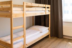 Voodi või voodid majutusasutuse Tailormade Hotel STANS SÜD toas