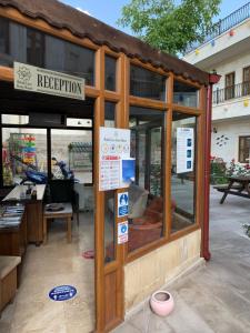 a building with a sign that reads reception at Cappadocia Ozbek Stone House in Goreme