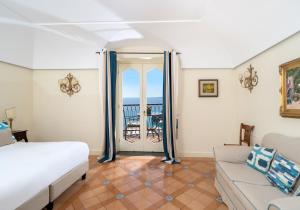 Postel nebo postele na pokoji v ubytování Hotel Punta Regina