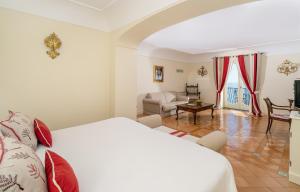 Postel nebo postele na pokoji v ubytování Hotel Punta Regina