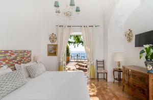 Posteľ alebo postele v izbe v ubytovaní Hotel Punta Regina + 37 fotografií