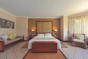 Кровать или кровати в номере Dinarobin Beachcomber Golf Resort & Spa