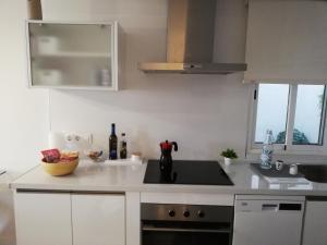 Kuchyň nebo kuchyňský kout v ubytování Apartamento coqueto, parking incluido