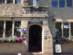 a building with a sign that reads the people inn at Pendle Inn in Barrowford