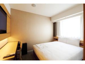 Cama ou camas em um quarto em Henn na Hotel Premier Nara