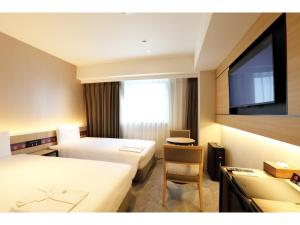 Cama ou camas em um quarto em Henn na Hotel Premier Nara