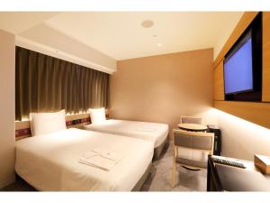 Cama ou camas em um quarto em Henn na Hotel Premier Nara