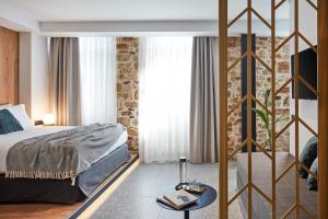 A bed or beds in a room at Λιθεία-Lithia