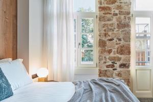A bed or beds in a room at Λιθεία-Lithia