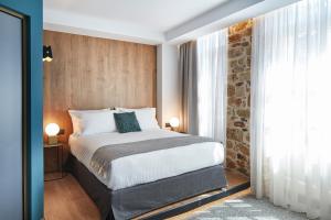 A bed or beds in a room at Λιθεία-Lithia