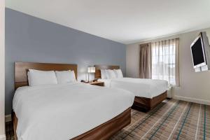 Postel nebo postele na pokoji v ubytování MainStay Suites Port Arthur - Beaumont South